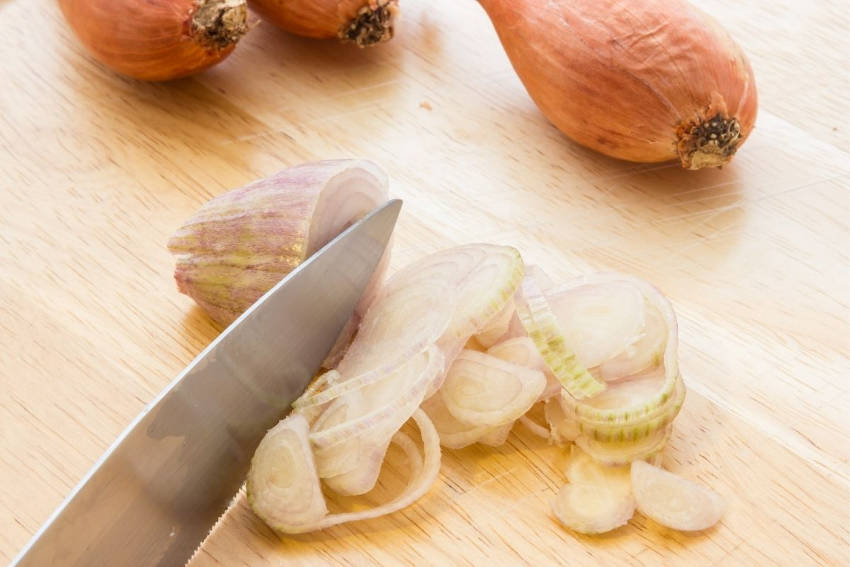 Chopping shallots in the kitchen