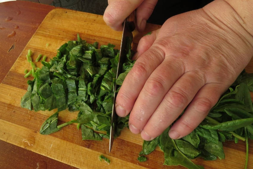 Chopping sorrel in a kitchen