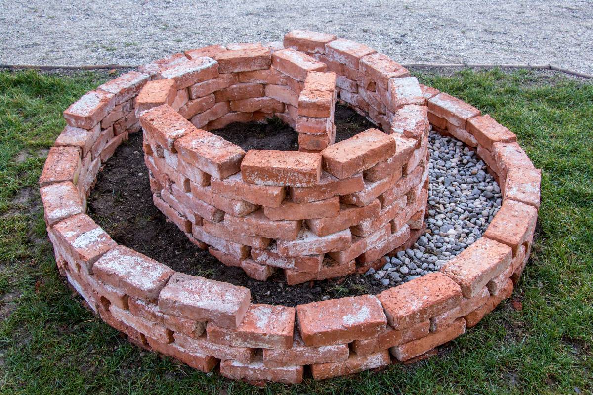 The brick structure of a herb spiral