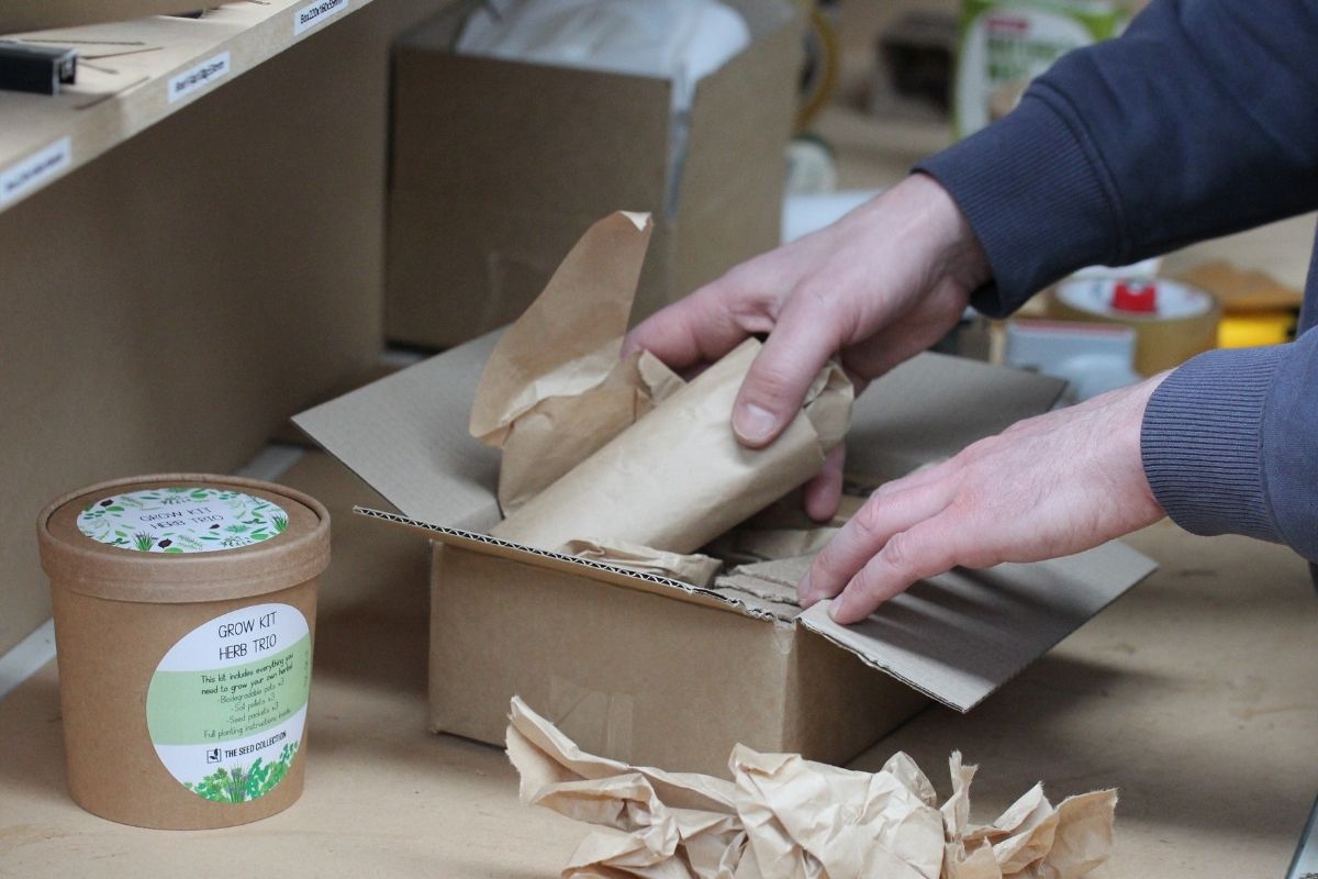 An order being packed with brown paper