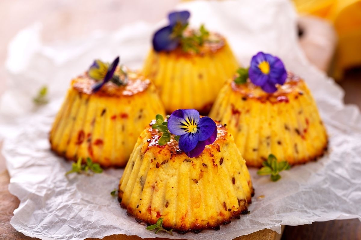 Cup cakes decorated with viola flowers