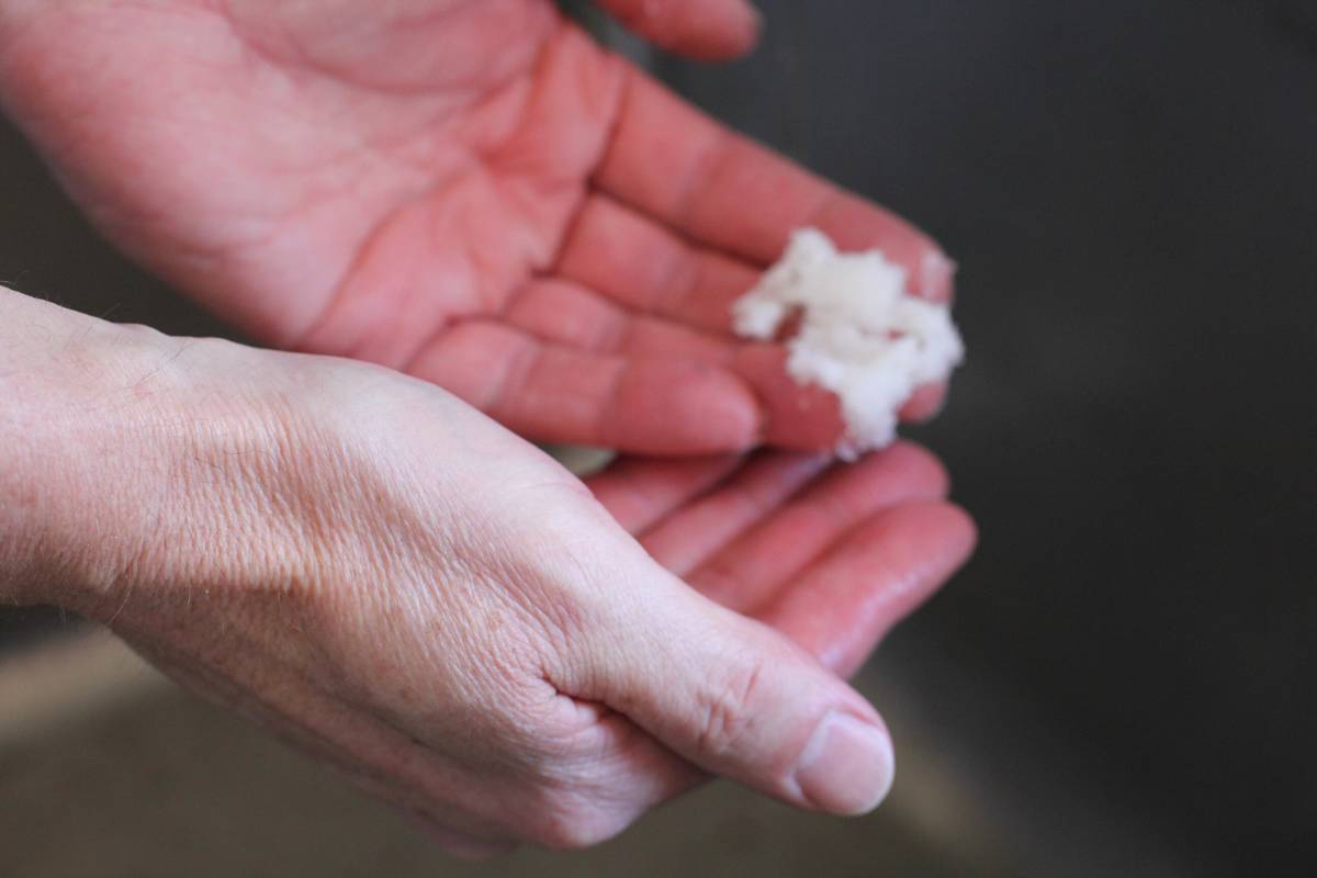 A man washing his hands with the gardeners hand scrub