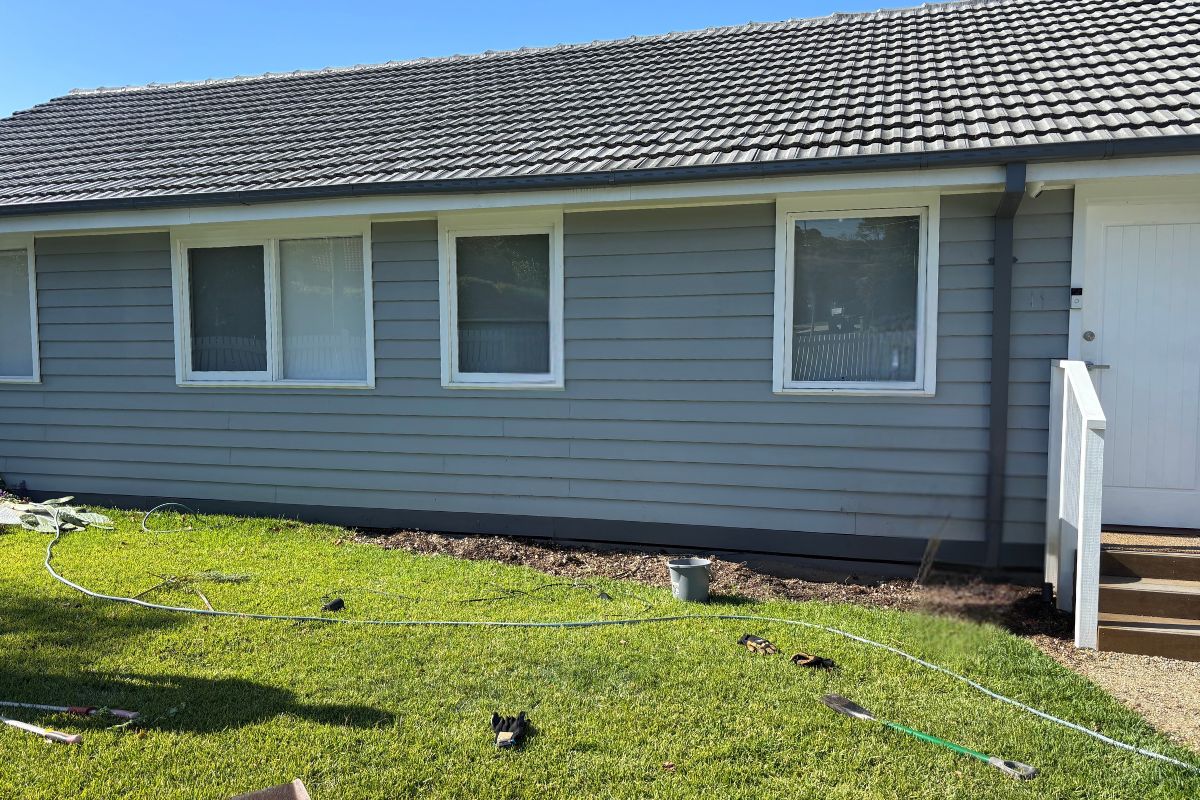 Using a garden hose to mark out garden bed
