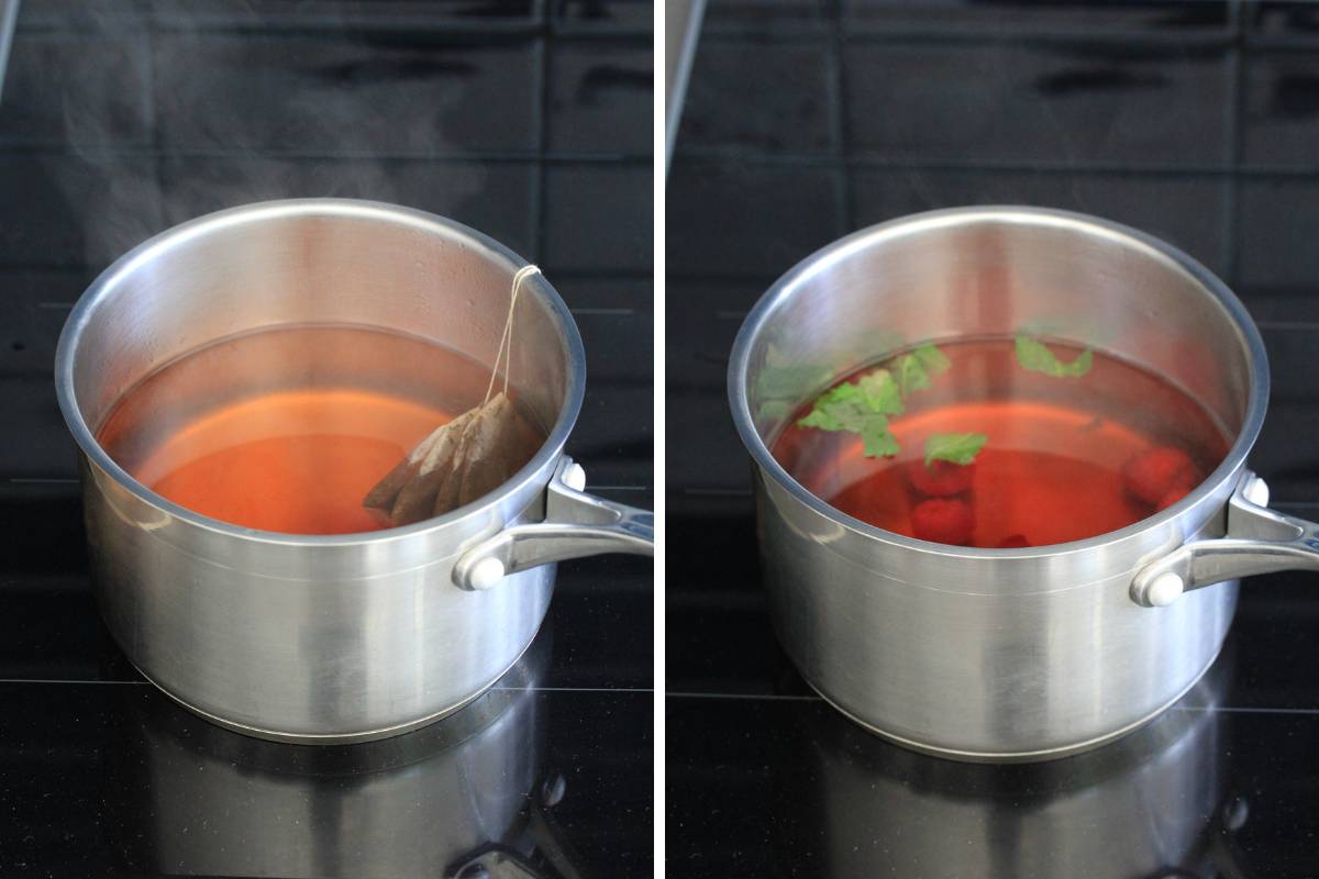 A saucepan containing water and tea bags, mint and rapsberries